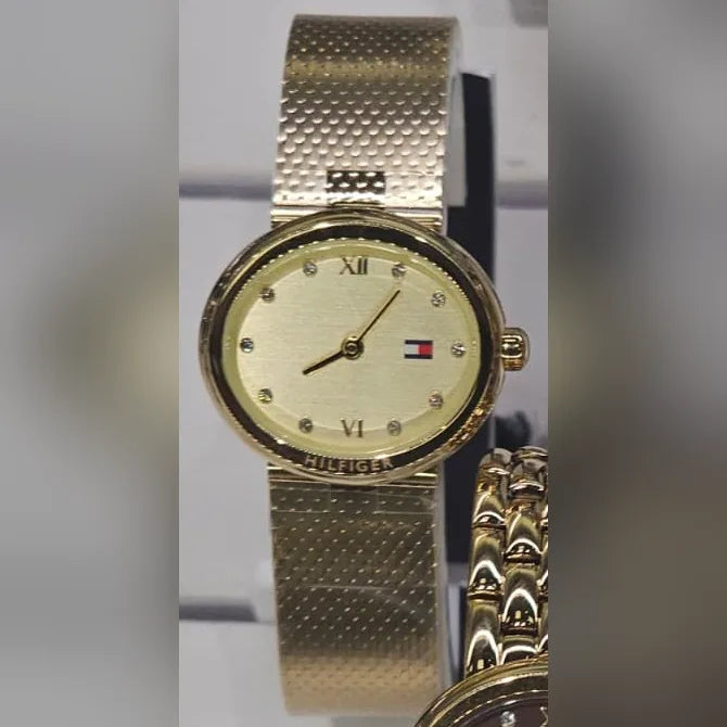 Tommy Hilfiger Gold oval, textured mesh, champagne dial